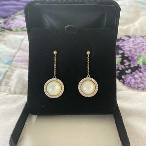10k mother of pearl and diamond earrings.